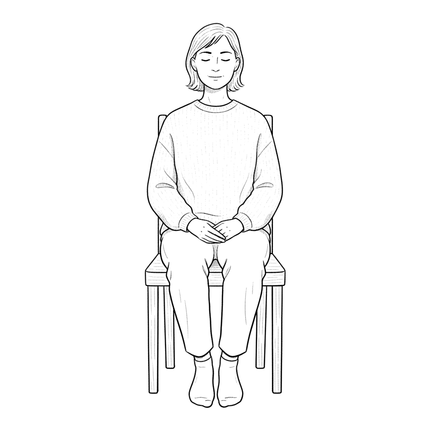 A person sitting upright, feet flat on the floor.